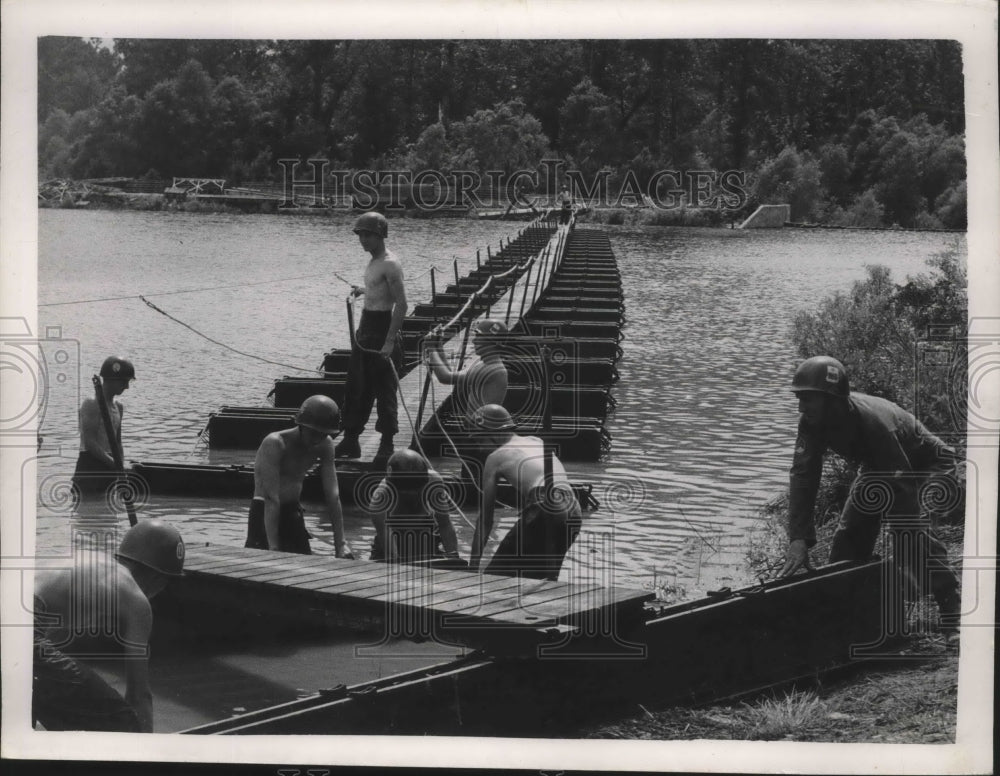 1950, Alabama National Guard 31st Dixie Division building a bridge. - Historic Images