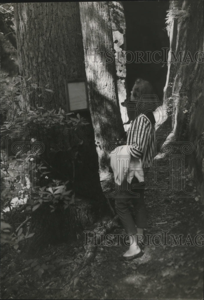 1957 Alabama-Woman admires the Dismals' Wonder Gardens. - Historic Images