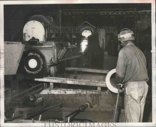 1956, Alabama-Birmingham, U.S. Pipe worker uses emery wheel on pipe. - Historic Images