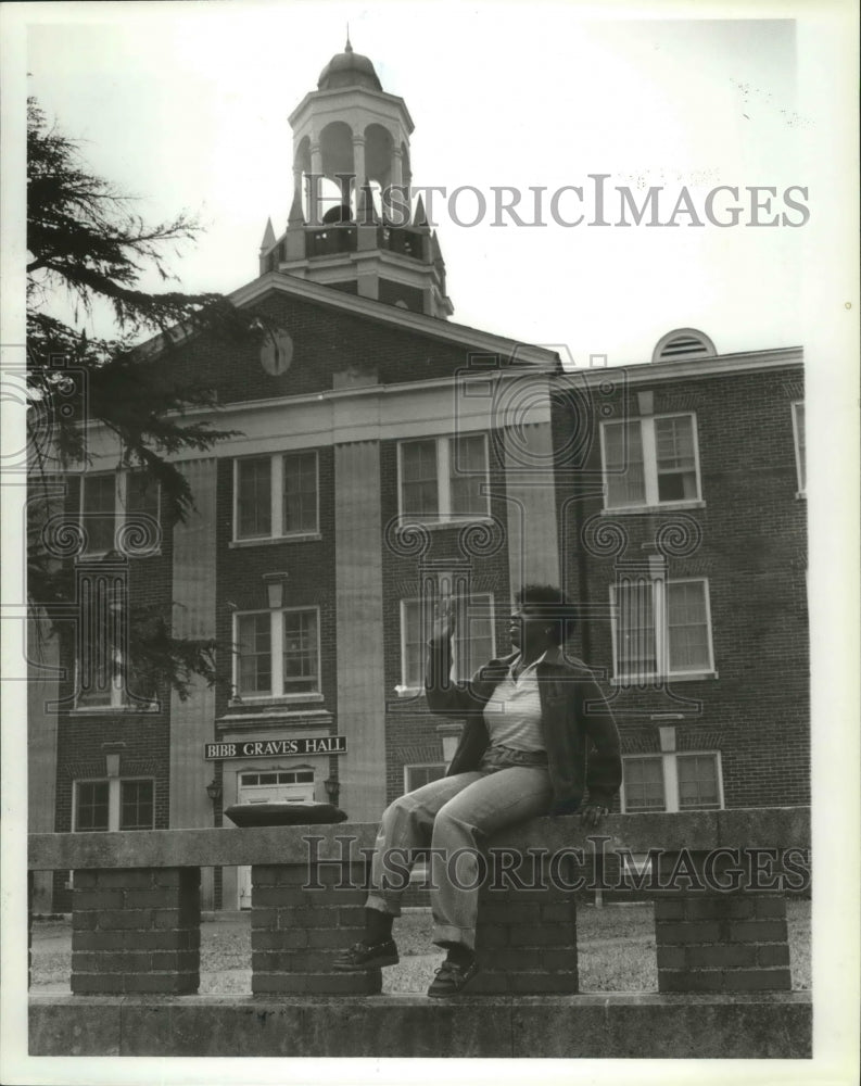 1981 Press Photo Shirley Trawick Sits by Bibb Graves Hall, Alabama State College - Historic Images