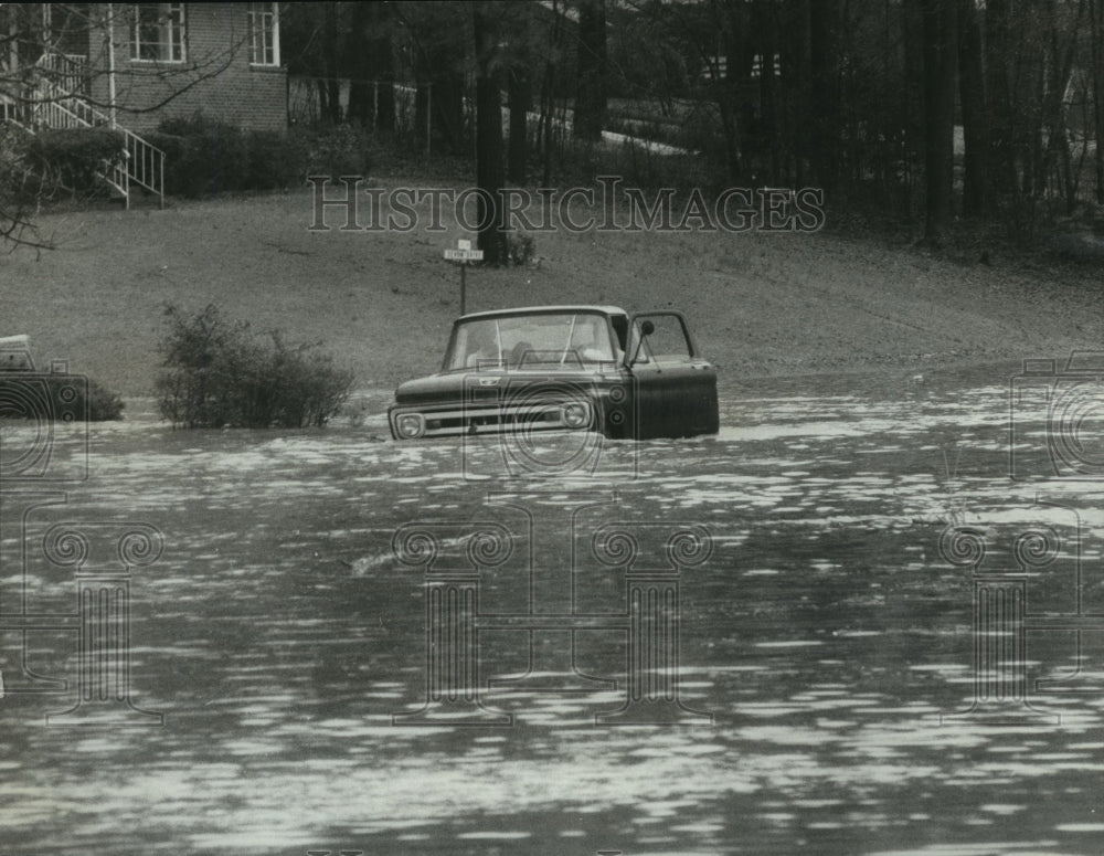 1970 Alabama-Motorist's truck is trapped in Birmingham flood water.-Historic Images