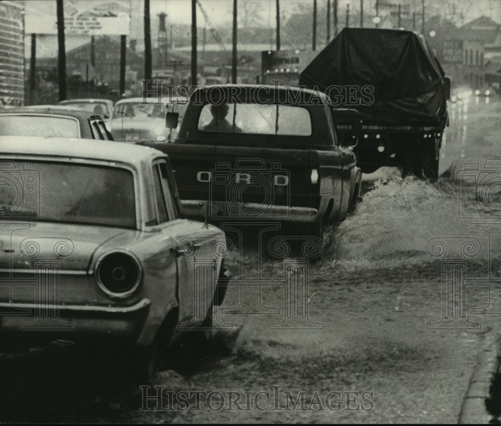 1972, Alabama-Birmingham work traffic slows to a crawl in flood water - Historic Images