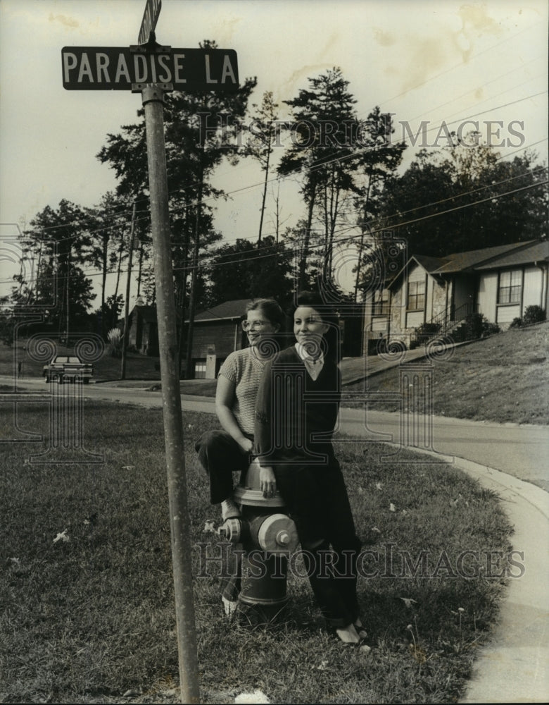 1981, Alabama-Center Point women on guard as they sit on hydrant. - Historic Images