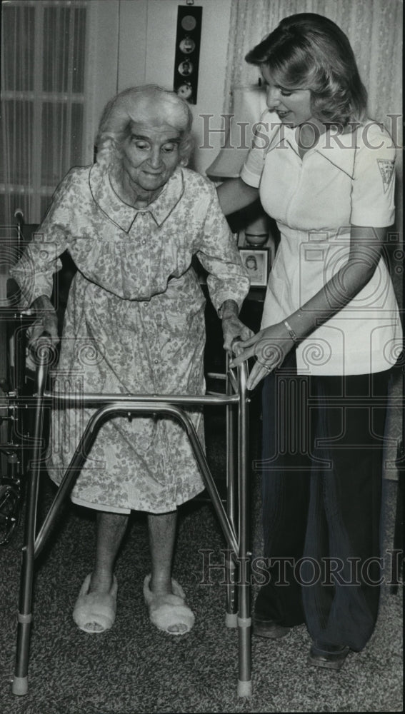 1978 Therapist Lynn Mosley assists Winnie Humber at her house-Historic Images