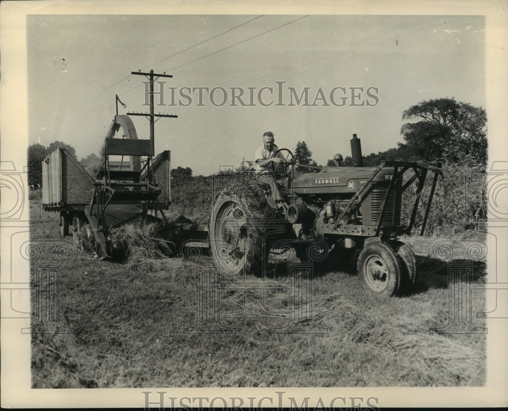 1945, Alabama farmer works his land with his tractor equipment. - Historic Images