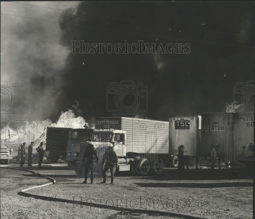 1966, Volunteers Try to Save Loaded Trailers From Fire in Alabama - Historic Images