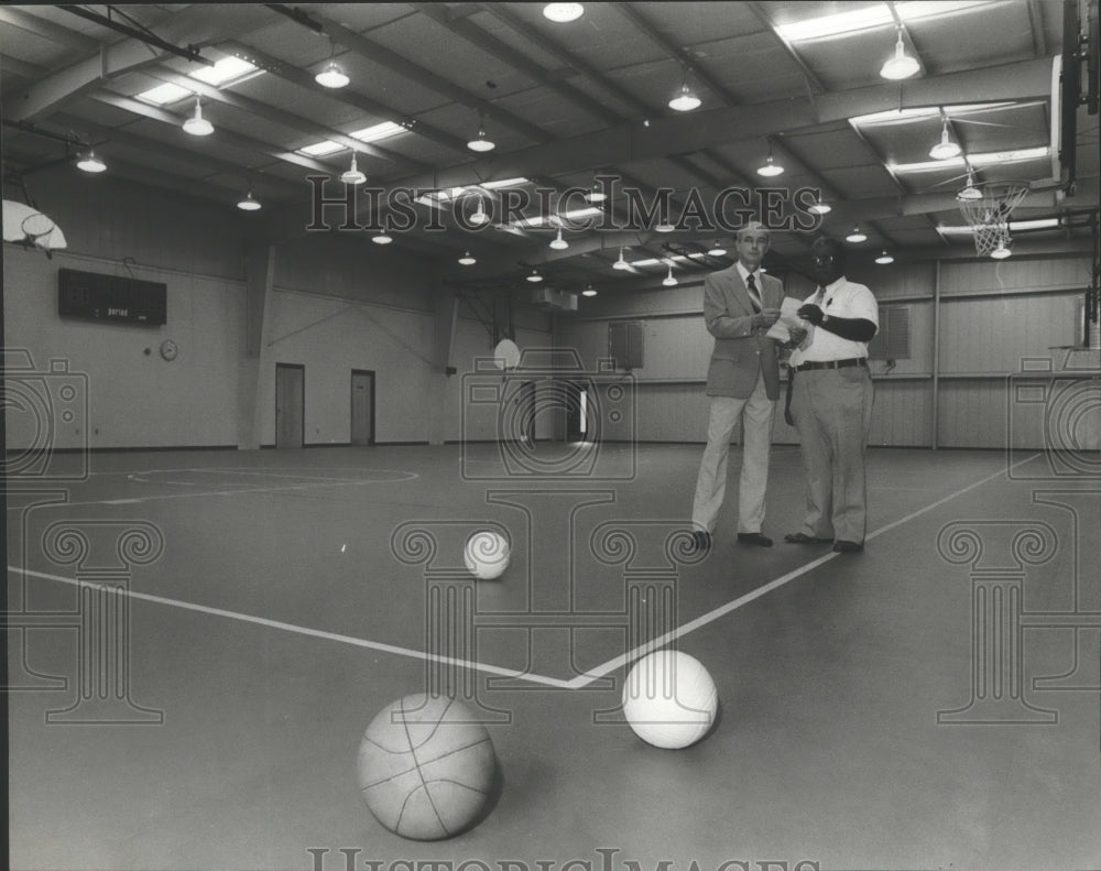 1980 Press Photo Don Byrd, Henry Dobbins Inspect New Gym, Fairfield, Alabama - Historic Images