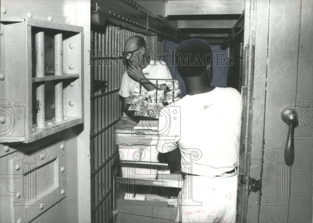 1969, Trustees Wheel Food Cart Down Cells in Jefferson County Jail - Historic Images