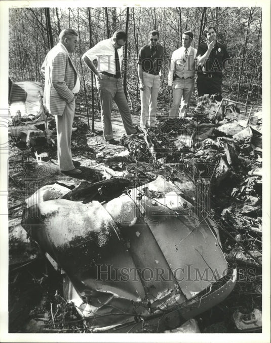 1978 Press Photo Group of men survey plane crash in the woods - abna11462 - Historic Images