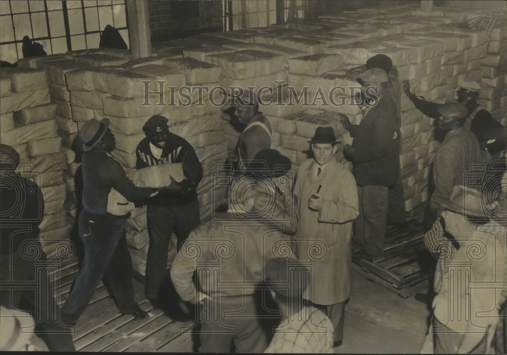 1961 Volunteers unload shipment of government food, Jefferson County-Historic Images