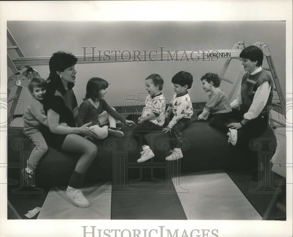 1987 Press Photo Toddlers and teachers at exercise gym - abna11722 - Historic Images