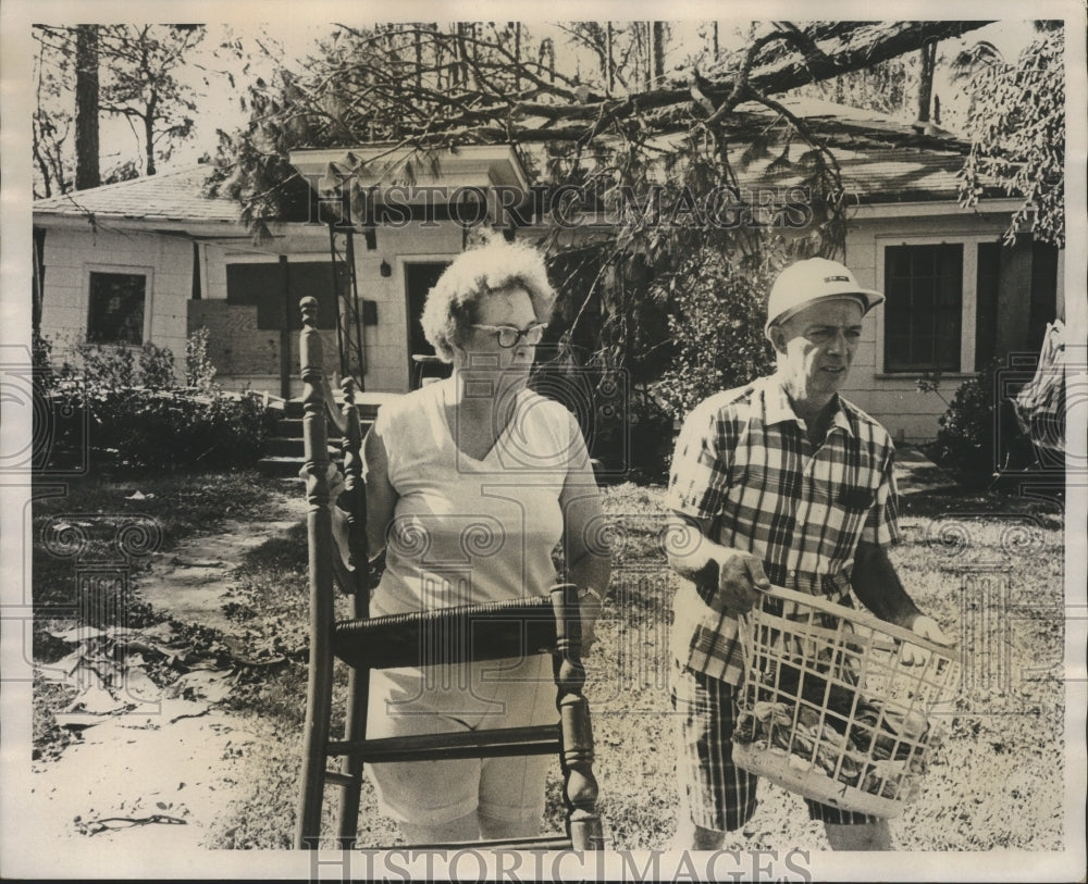 1969 Unidentified couple in front of storm damaged home, Birmingham-Historic Images