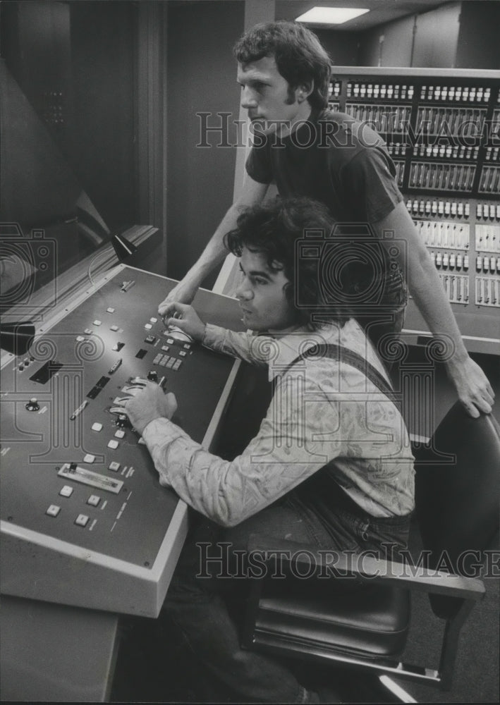 1976 Director Eric Olson explains lighting to student Sammy Bailey - Historic Images