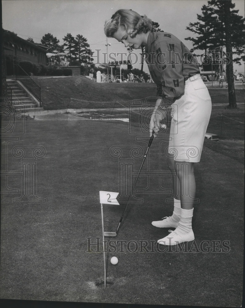 1959 Betty Lindstrom, Miss Alabama 1959, putts a golf ball-Historic Images