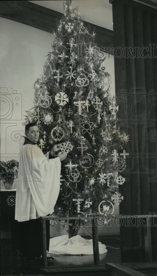 1964, Reverend Donald Myers by pine tree at Faith Lutheran Church - Historic Images
