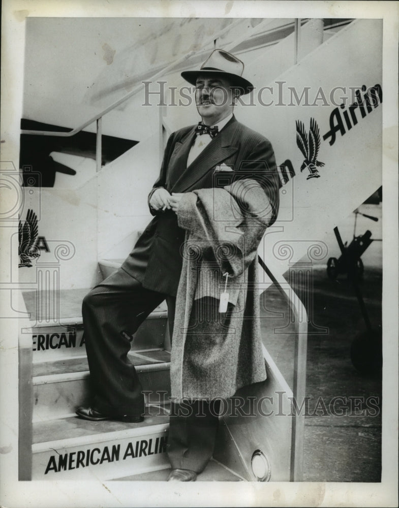 1946, Author Studson Strode poses on American Airlines staircase - Historic Images