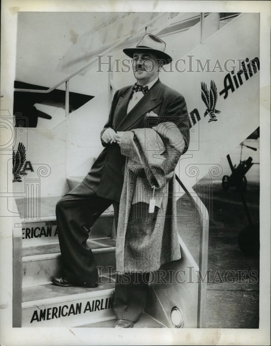 1946, Author Studson Strode poses on American Airlines staircase - Historic Images