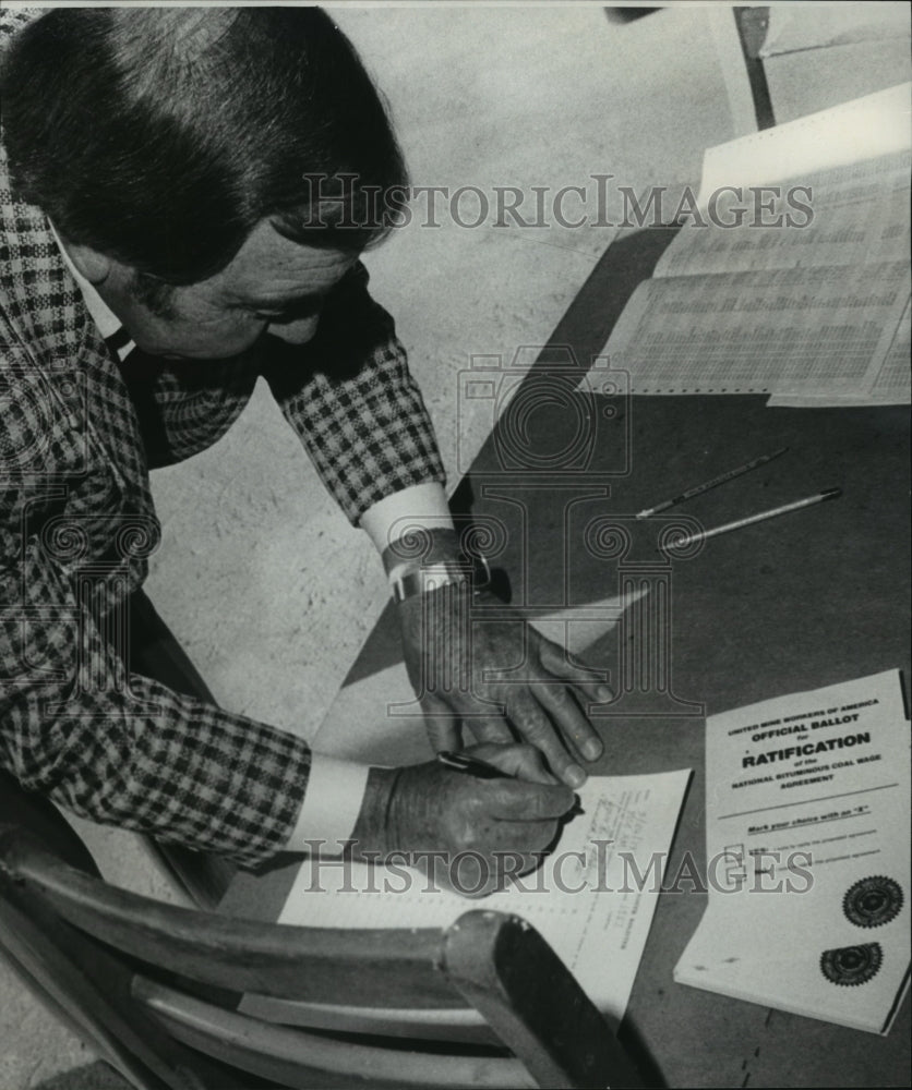 1978 United Mine Worker Gus Ambrose signs in to vote, Alabama - Historic Images