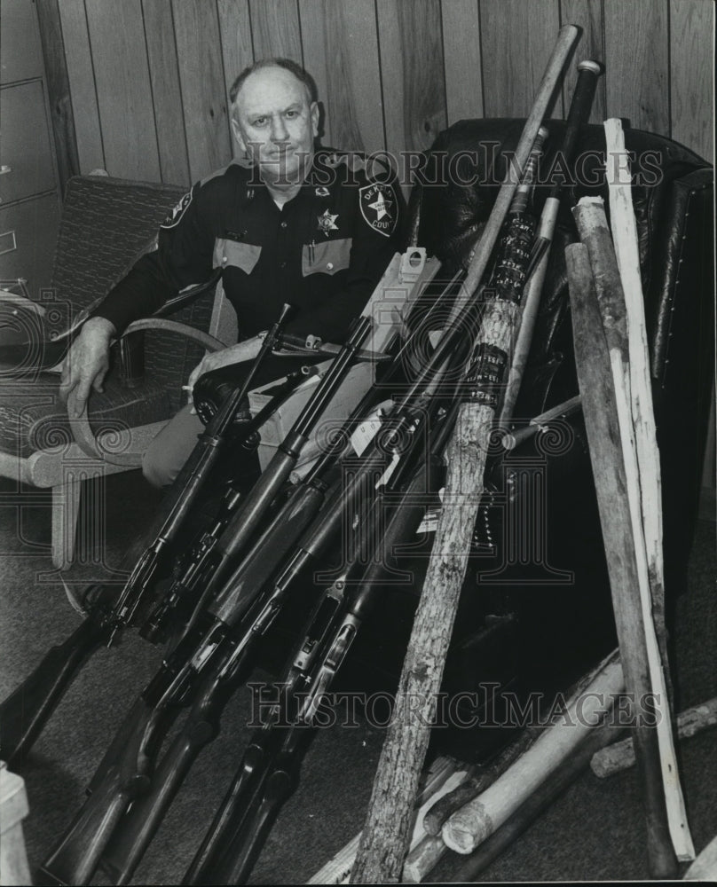 1978, Johnny Johnson of DeKalb Sheriff&#39;s Office with weapons - Historic Images