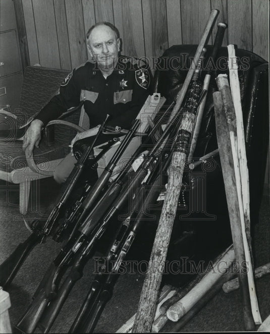 1978, Johnny Johnson of DeKalb Sheriff's Office with weapons - Historic Images