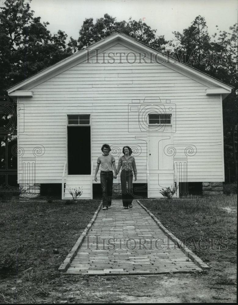 1974 Unidentified persons in front of restored church in Huntsville-Historic Images