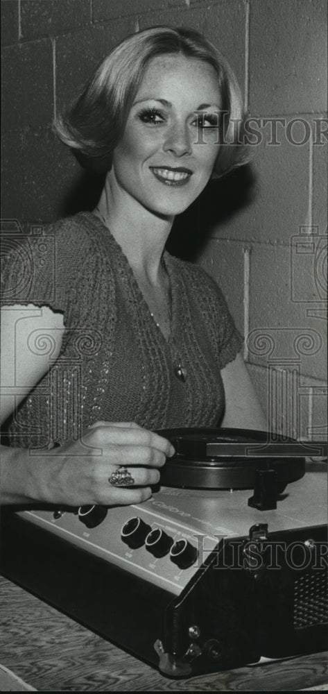 1980, Former Miss Alabama Cecil Jenkins (Snow) with a record player - Historic Images