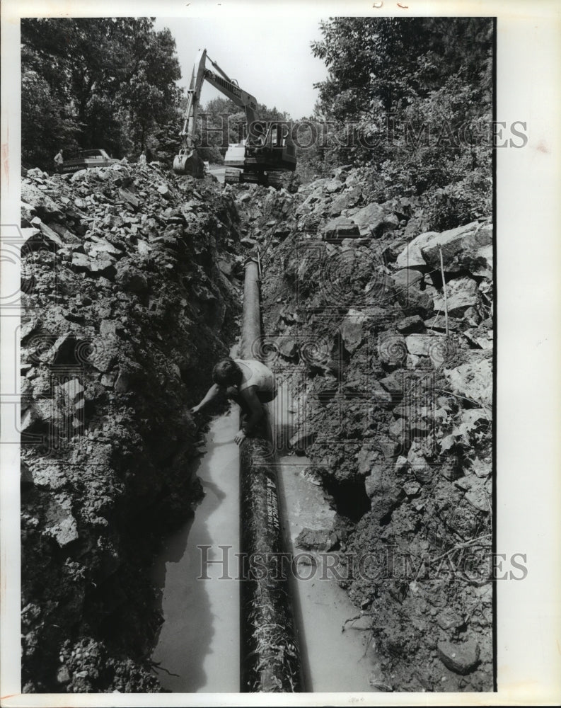 1979, Putting water pipe in place along South Shades Crest Rd., AL - Historic Images