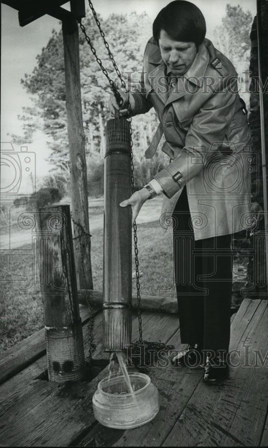 1977, Jerry Rouse draws water from a well, North Jefferson County, AL - Historic Images