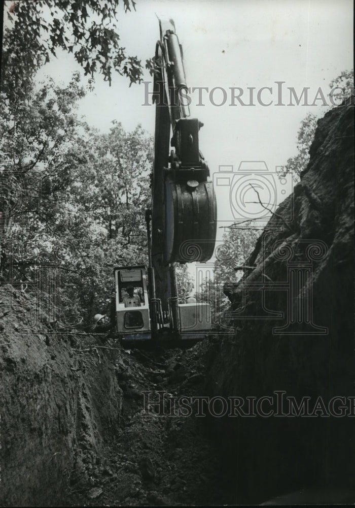 1974, Jefferson County ditch digger, digging ditch for Water line, AL - Historic Images