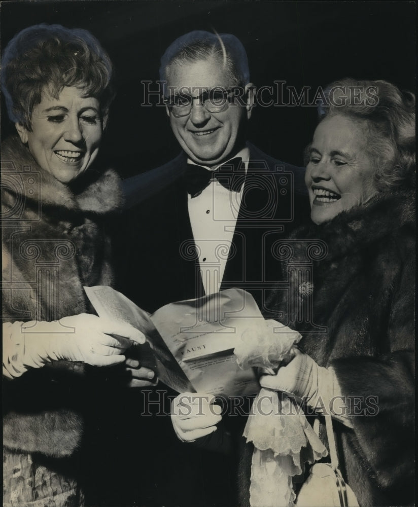 1969, Artist Doris Kennedy looks over program at opera - abna14204 - Historic Images