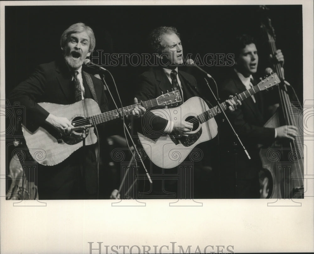 1990 Three On A String performs with symphony - Historic Images