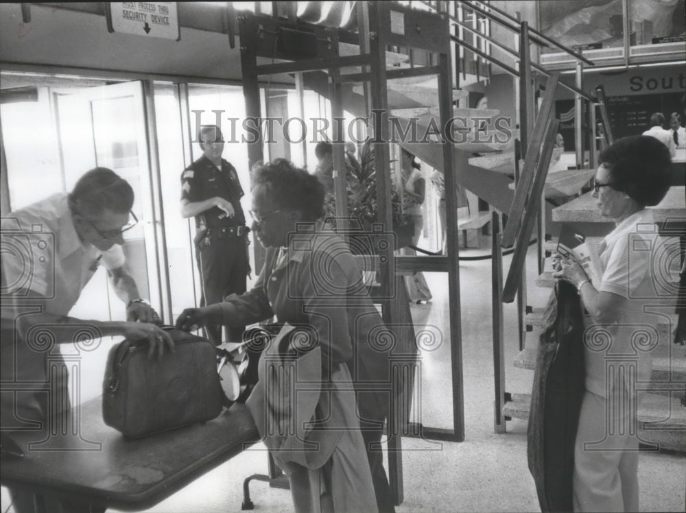 1978 Earl Smith does security check at Gadsden, Alabama airport-Historic Images