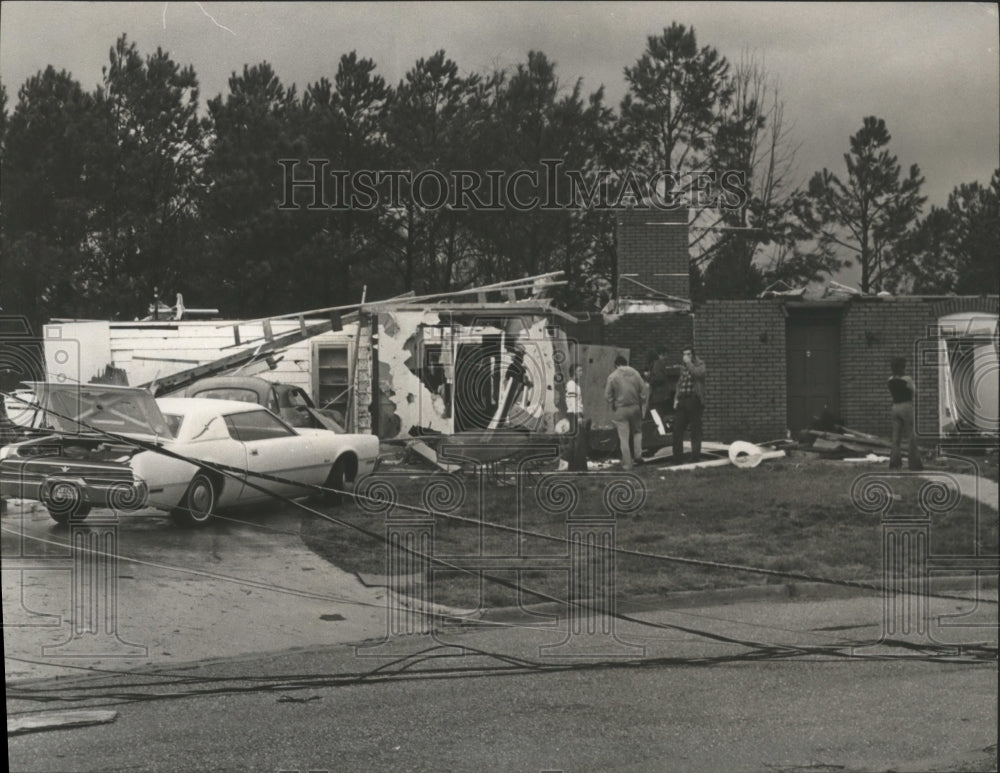 1975 Sutton Place Residents find belongings in tornado debris, AL - Historic Images