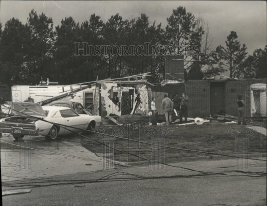 1975 Sutton Place Residents find belongings in tornado debris, AL - Historic Images