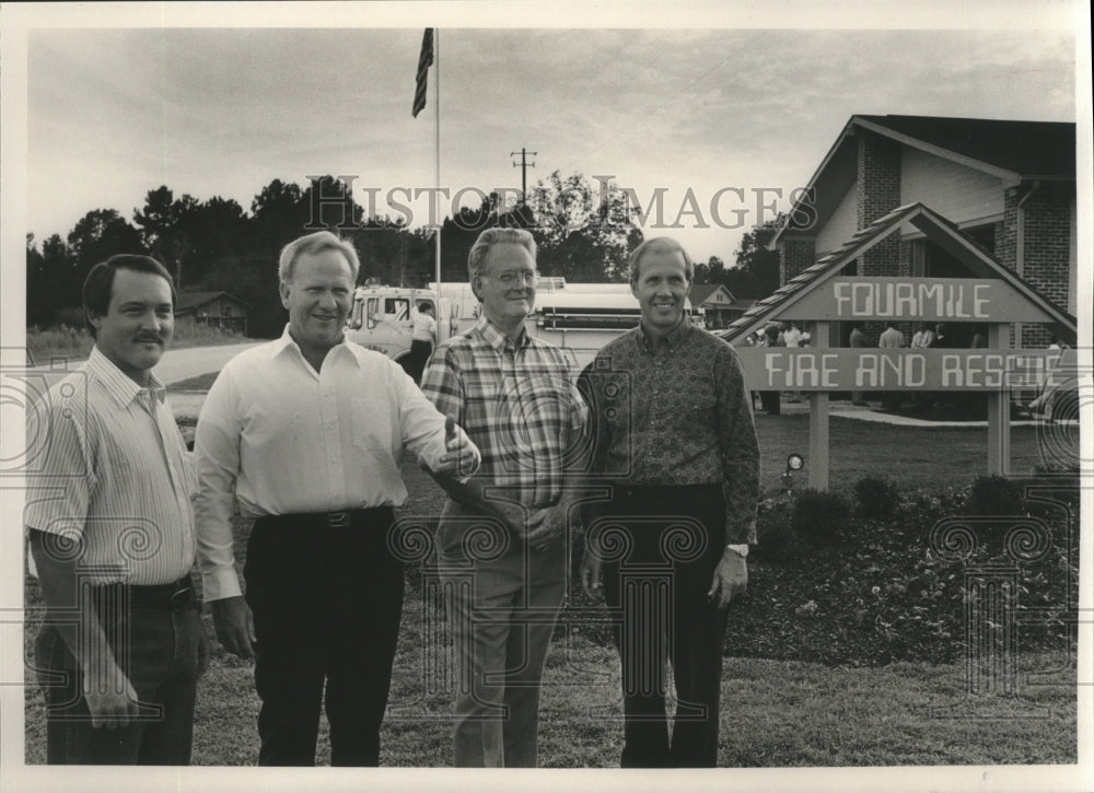 1989 Men stand outside of the Fourmile Fire &amp; Rescue Department - Historic Images