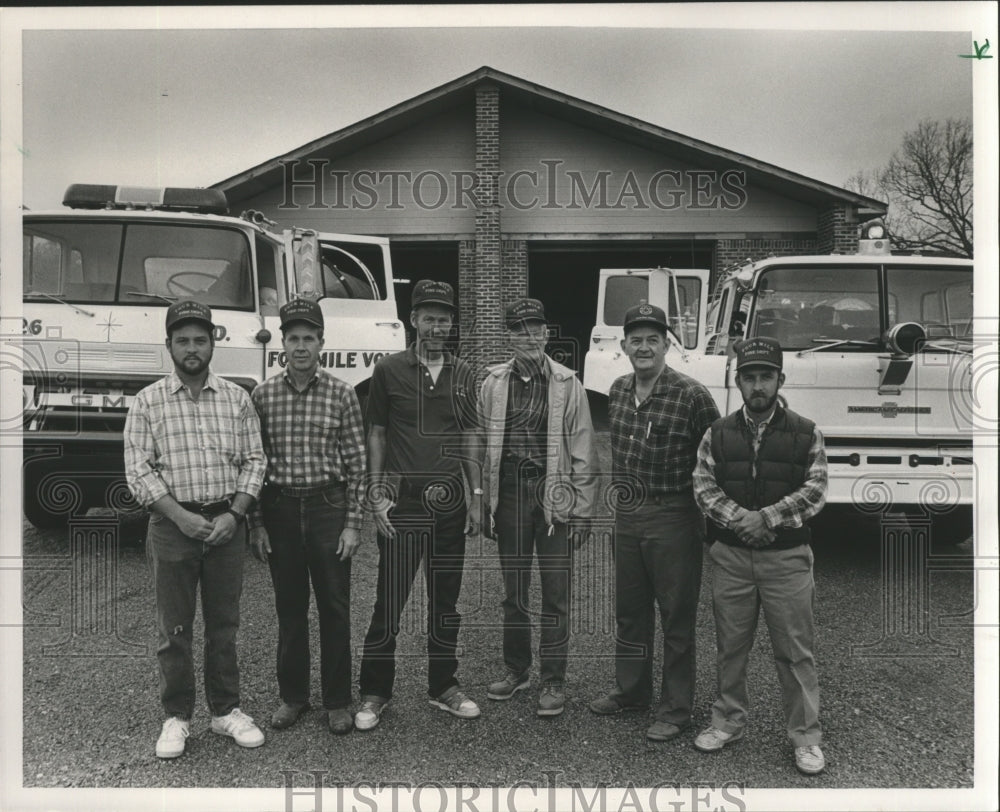 1987, Volunteers stand outside of the Fourmile Fire Department - Historic Images