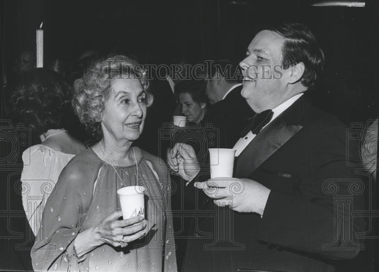 1977, Two guests talk and drink at the Gala IV event - abna15035 - Historic Images