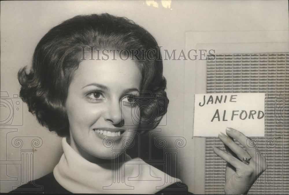 1969, Miss Alabama, Ann Fowler holding up Janie Alford Card - Historic Images
