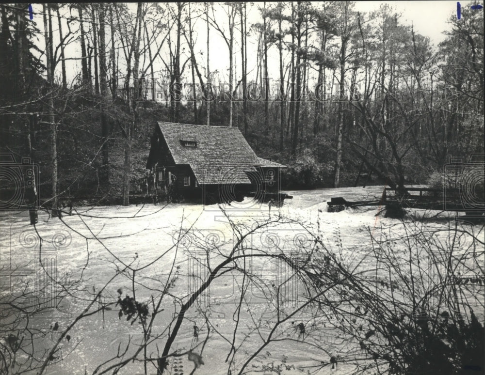 1982, Swollen Shades Creek collapses wooden bridge at Parkway - Historic Images