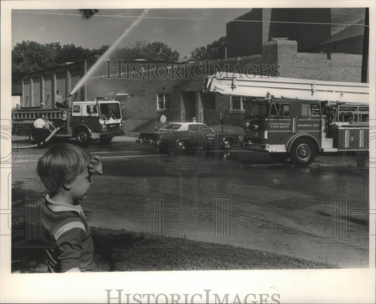 1985, Patrick Hails watches Homewood, Alabama Fire Department work - Historic Images