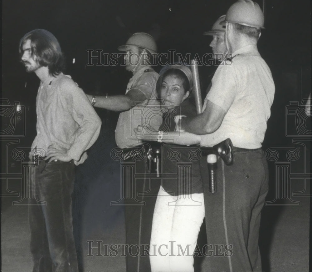 1970, Hippie-type and Woman arrested by police at University - Historic Images