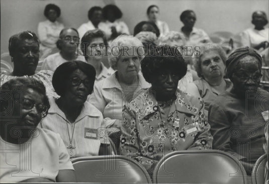 1980, Concern shows on faces at senior citizens hearing in Brighton - Historic Images