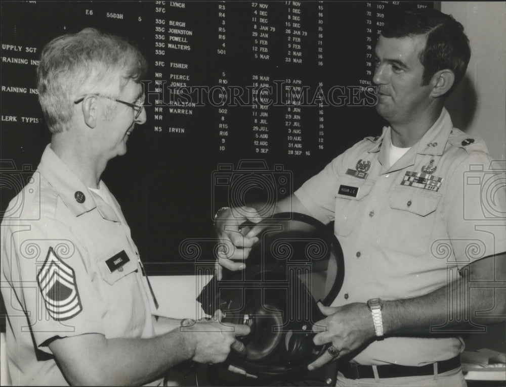 1979 Army Sergeant William Shadel, Captain John Hogan examine gear - Historic Images