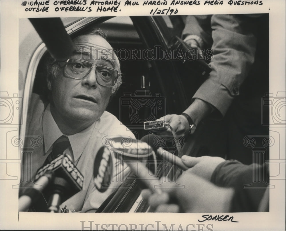 1990 Attorney Paul Hardin answers media questions from his car - Historic Images