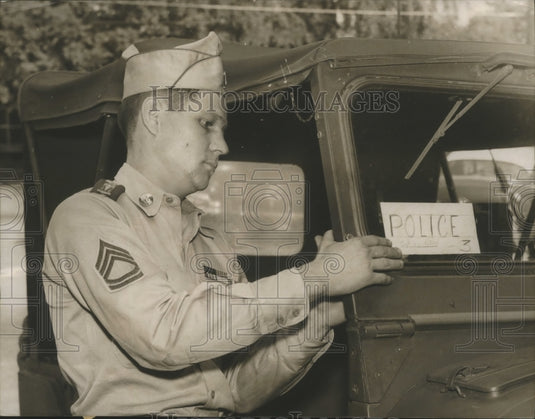 1954, C. E. Kimbrel puts "Police" Sign on National Guards Jeeps - Historic Images