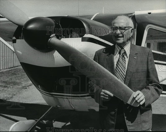 1975 Glenn Messer stands at propeller of plane used in re-enactment-Historic Images