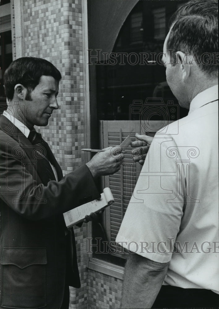 1973 &quot;Redcoat&quot; Eugene Price Hands Citation for Littering-Historic Images
