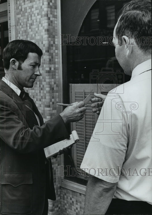 1973 "Redcoat" Eugene Price Hands Citation for Littering-Historic Images
