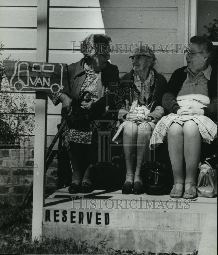 1980 Elderly sit on bench at Morris Senior Citizens Center, Alabama - Historic Images