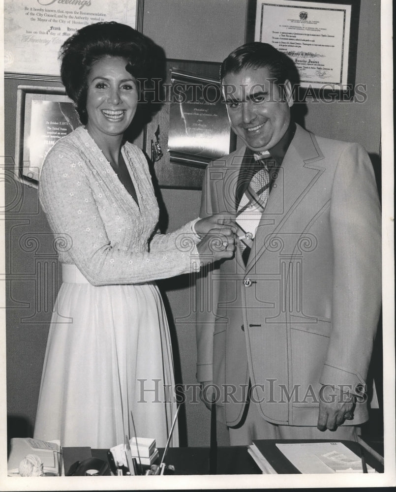 1974, Cornelia Wallace, wife of Alabama Governor, putting on pin - Historic Images